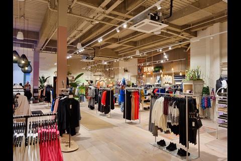 Interior of River Island's River Studios store in Derby, showing racks of womenswear